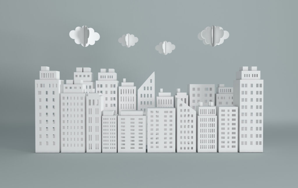 Das Bild zeigt eine Stadt aus Papier mit Wolken aus Papier.